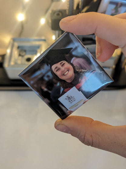 A photo of a girl graduating on a custom photo magnets 